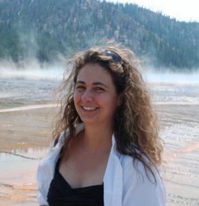 photo of Jen Hill Myers with tree-covered hill in background